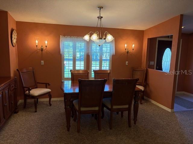 1894 Elizabeth Lane Mount Dora, FL 32757 - Photo 10 of 69 a view of a dining room with furniture and window