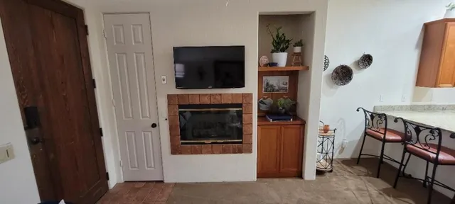 a bedroom with a bed and a potted plant