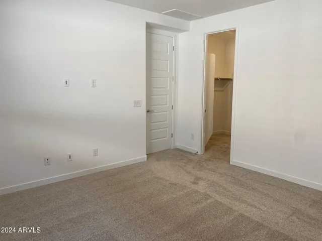 an empty room with closet area