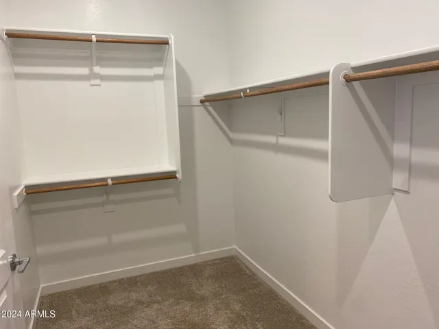 a view of an empty walk in closet