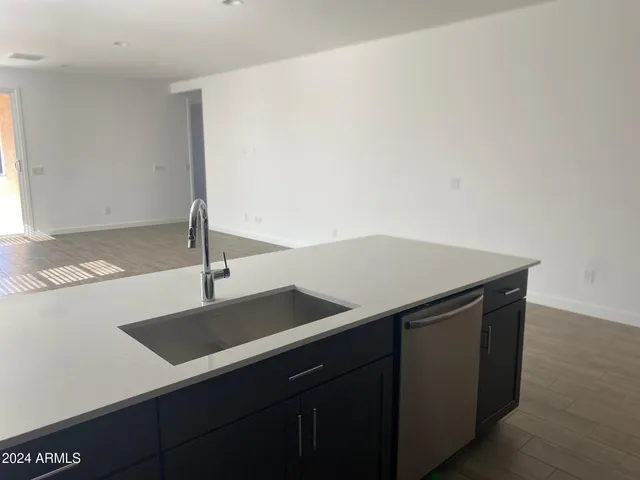 a kitchen with a sink and a refrigerator