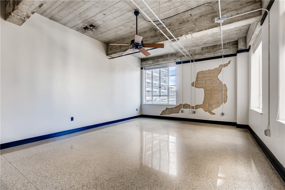 710 Colorado Street, Unit 4J Austin, TX 78701 - Photo 8 of 37 Huge living/dining area! Vintage terrazzo floors.