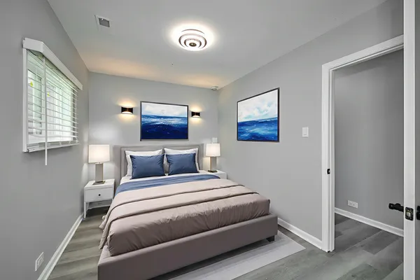a bedroom with a bed and a window