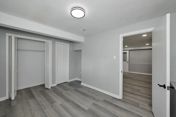 an empty room with wooden floor