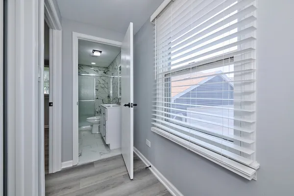 a bathroom with a shower and a sink