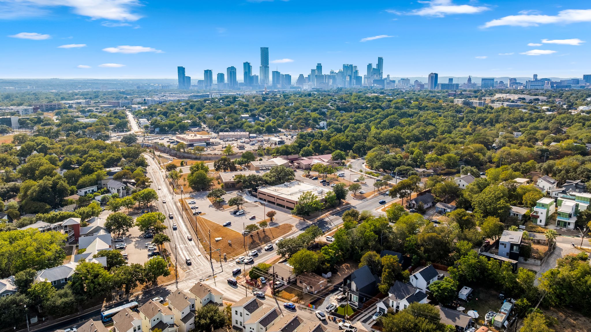 2900 Webberville Road Austin, TX 78702 - Photo 3 of 22 Panoramic neighborhood views showcase the impressive distant city skyline rising above a lush canopy.