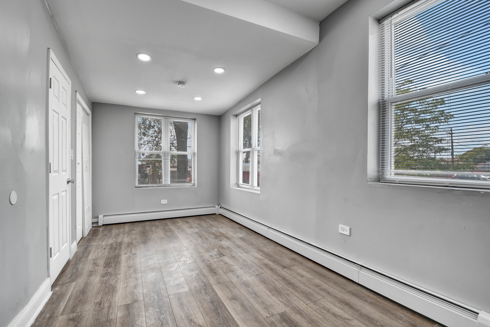 7409 West 63rd Place Summit, IL 60501 - Photo 8 of 18 a view of empty room with wooden floor and fan