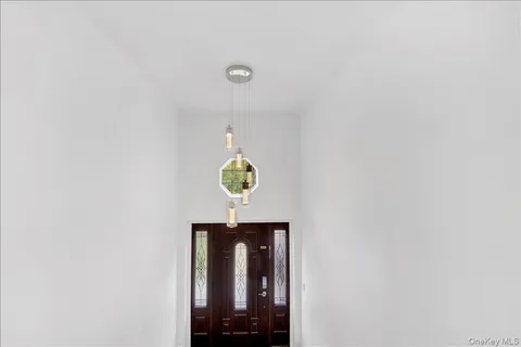 a view of a hallway with washer and dryer
