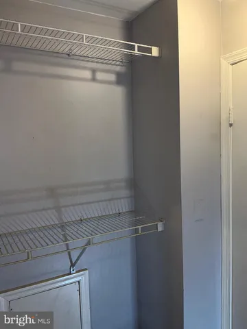 a view of a room with racks on the wall