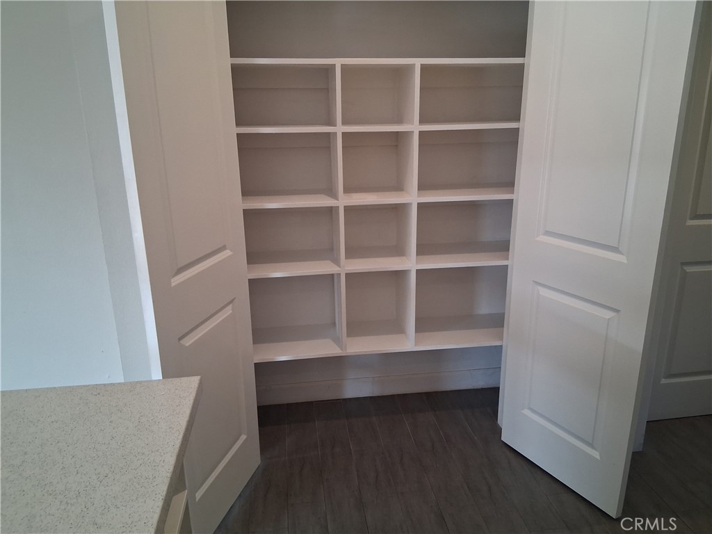 1040 Cedar Avenue, Unit 6 Long Beach, CA 90813 - Photo 7 of 17 a view of an empty room with empty racks