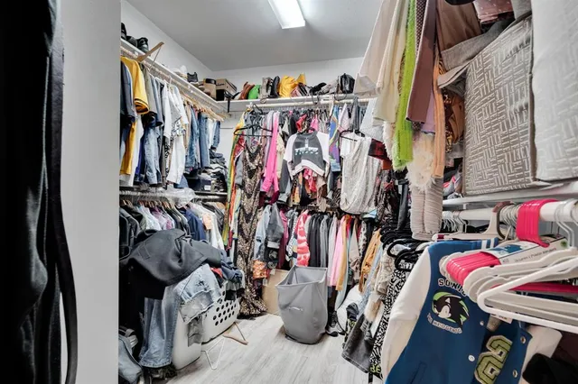 a bathroom with a sink vanity and shower