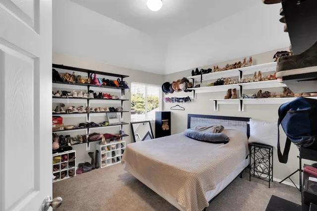 a living room with furniture a chandelier and a window
