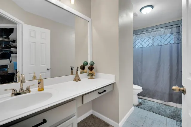 a bedroom with a bed and closet