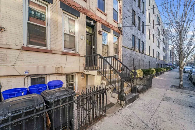 a view of a brick building with many windows