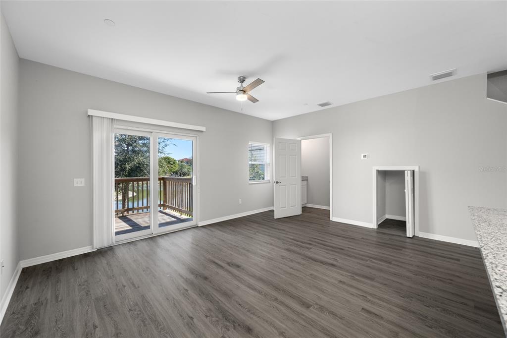 2115 Sebring Place Clearwater, FL 33760 - Photo 11 of 59 wooden floor in an empty room with a window