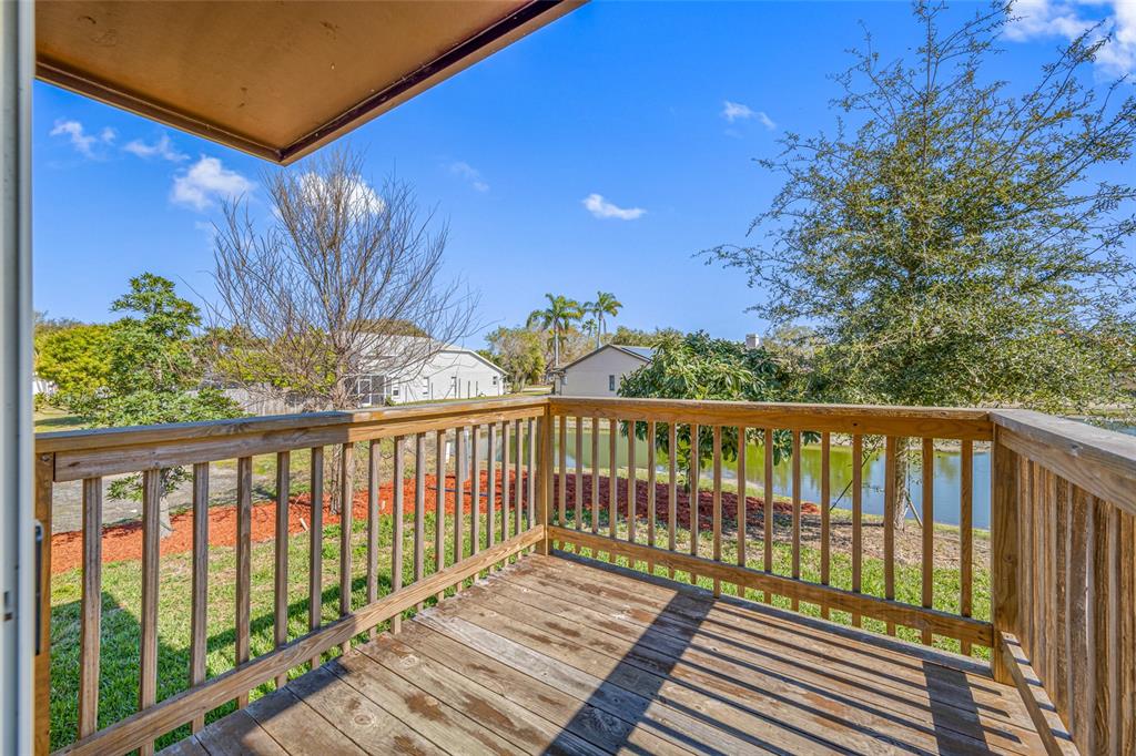 2115 Sebring Place Clearwater, FL 33760 - Photo 18 of 59 a view of a balcony with wooden fence