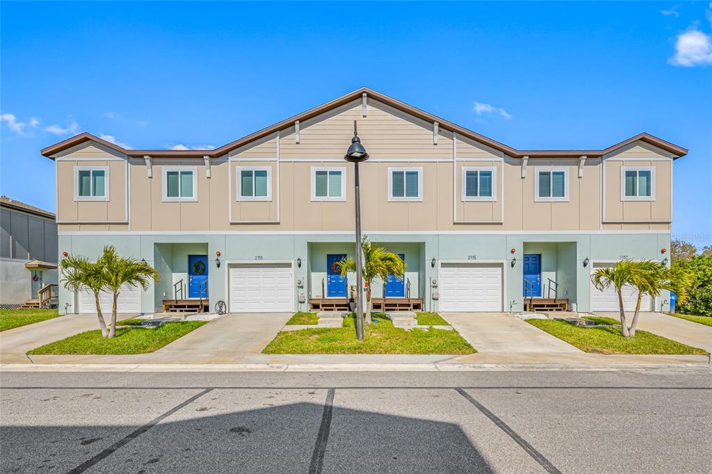 2115 Sebring Place Clearwater, FL 33760 - Photo 2 of 59 a view of a house with a swimming pool and a chairs