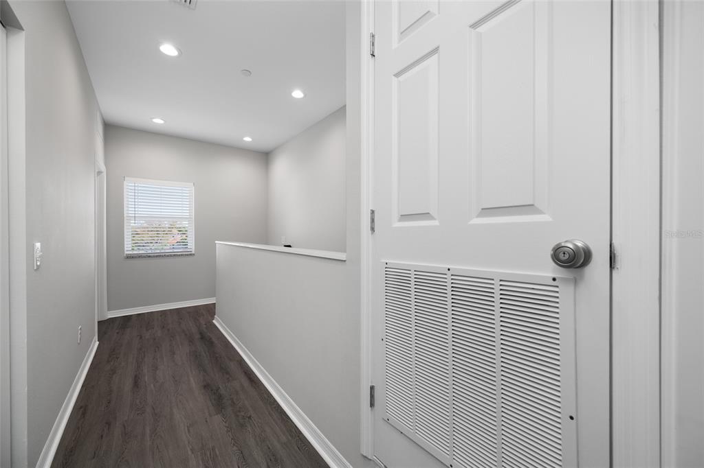 2115 Sebring Place Clearwater, FL 33760 - Photo 35 of 59 a view of hallway with wooden floor