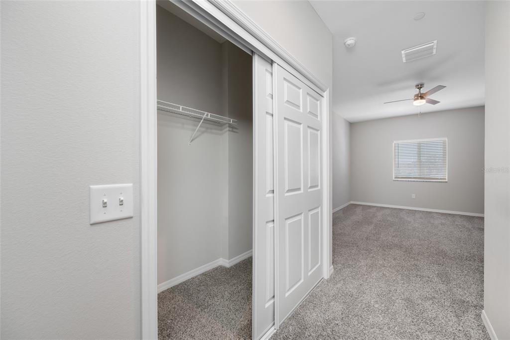 2115 Sebring Place Clearwater, FL 33760 - Photo 36 of 59 a view of a hallway with wooden shelves