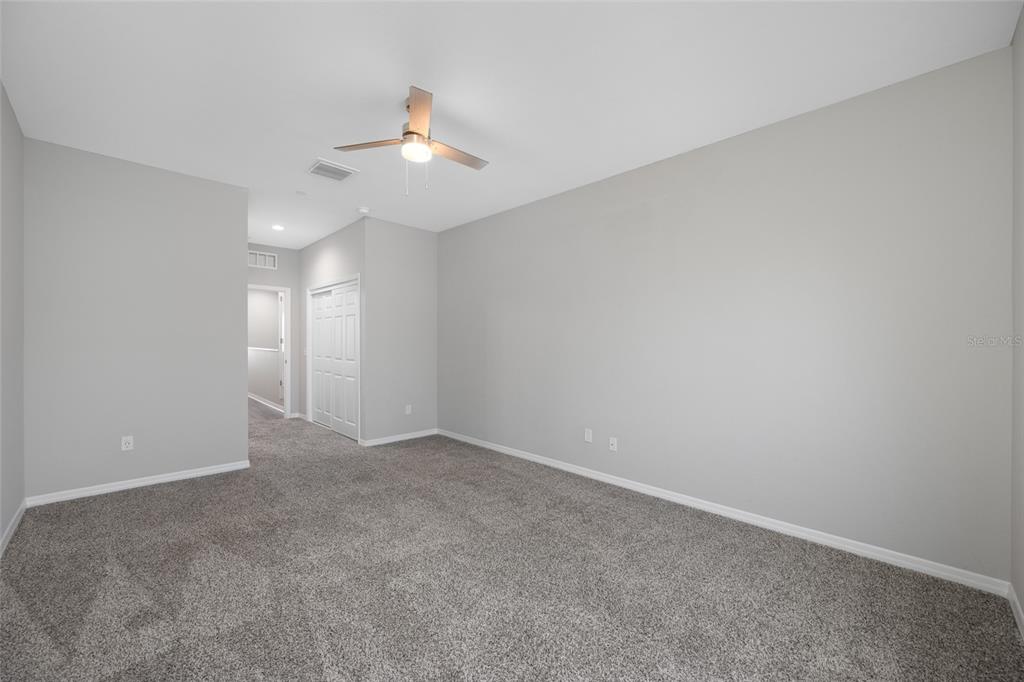 2115 Sebring Place Clearwater, FL 33760 - Photo 39 of 59 a view of an empty room with a chandelier fan