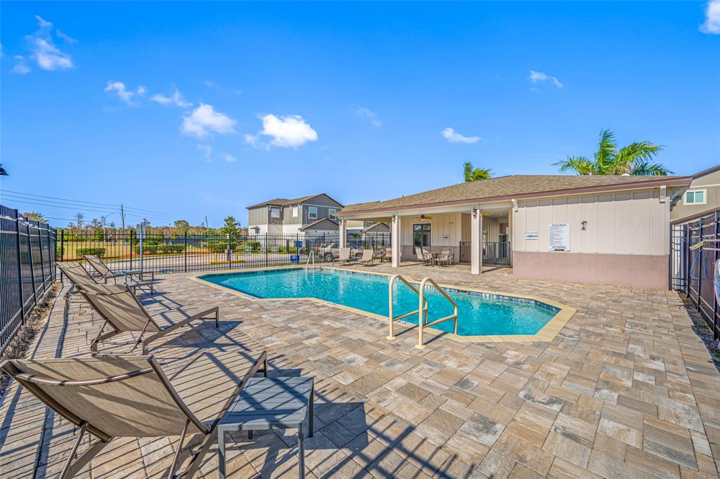 2115 Sebring Place Clearwater, FL 33760 - Photo 47 of 59 a view of a house with pool and sitting area