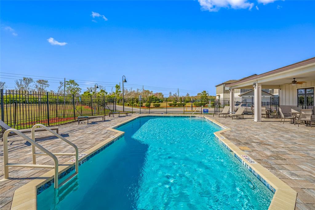 2115 Sebring Place Clearwater, FL 33760 - Photo 48 of 59 a view of a swimming pool with an ocean view