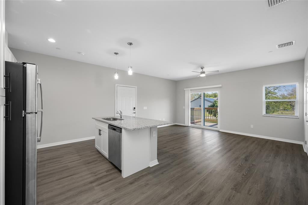 2115 Sebring Place Clearwater, FL 33760 - Photo 5 of 59 a kitchen with stainless steel appliances granite countertop a sink stove and refrigerator