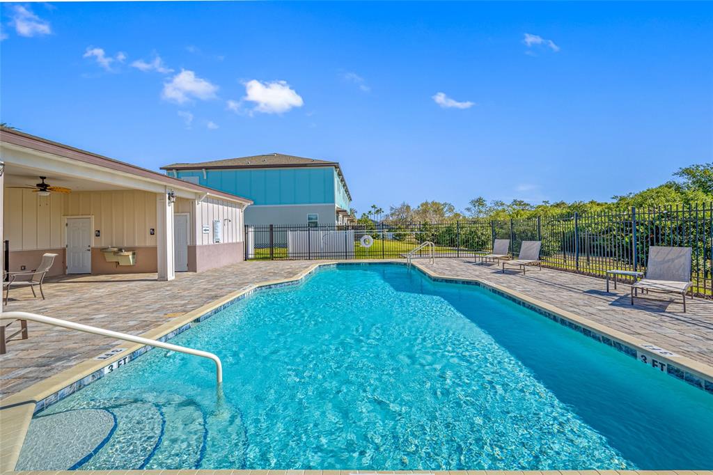 2115 Sebring Place Clearwater, FL 33760 - Photo 52 of 59 a swimming pool with outdoor seating and yard
