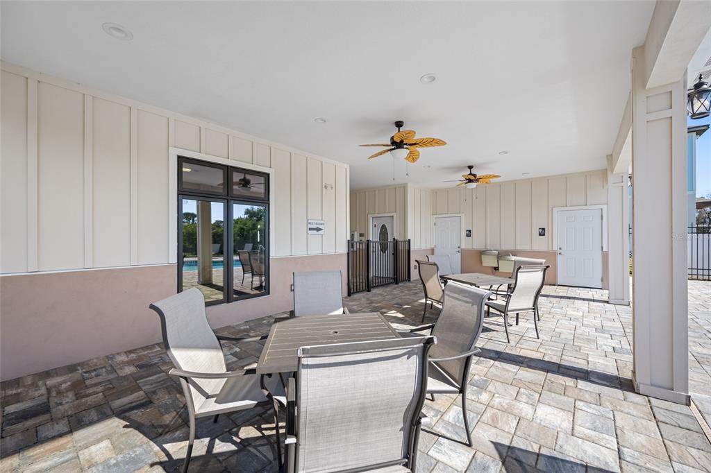 2115 Sebring Place Clearwater, FL 33760 - Photo 53 of 59 a view of a dining room with furniture and a potted plant