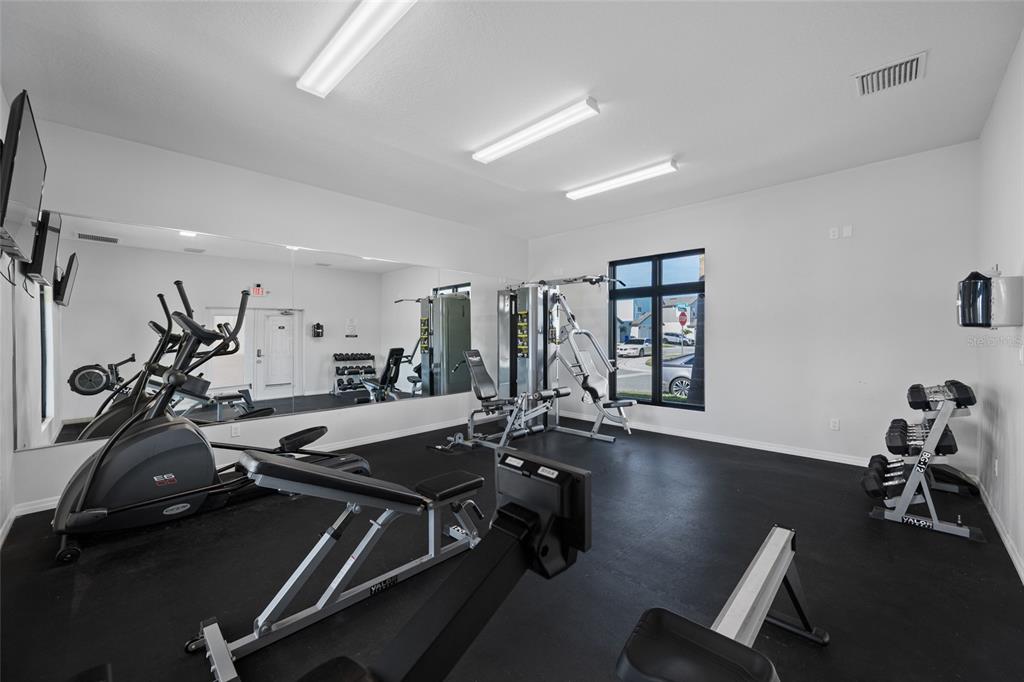 2115 Sebring Place Clearwater, FL 33760 - Photo 56 of 59 a room with gym equipment and a large window