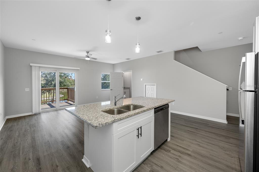 2115 Sebring Place Clearwater, FL 33760 - Photo 8 of 59 a kitchen with sink and wooden floor