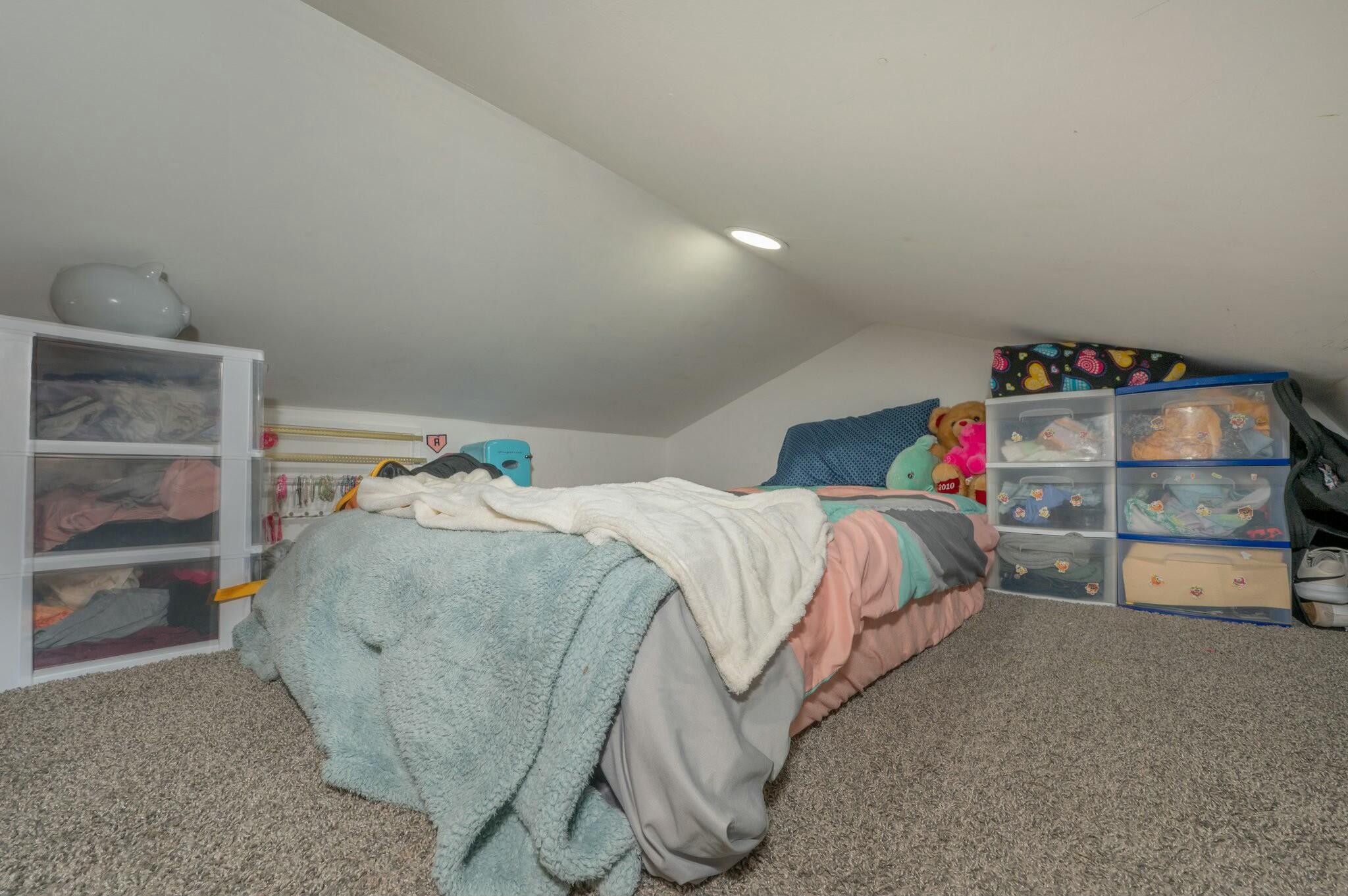 6188 Old River Road Baker, FL 32531 - Photo 18 of 34 a bed sitting in a bedroom next to a window