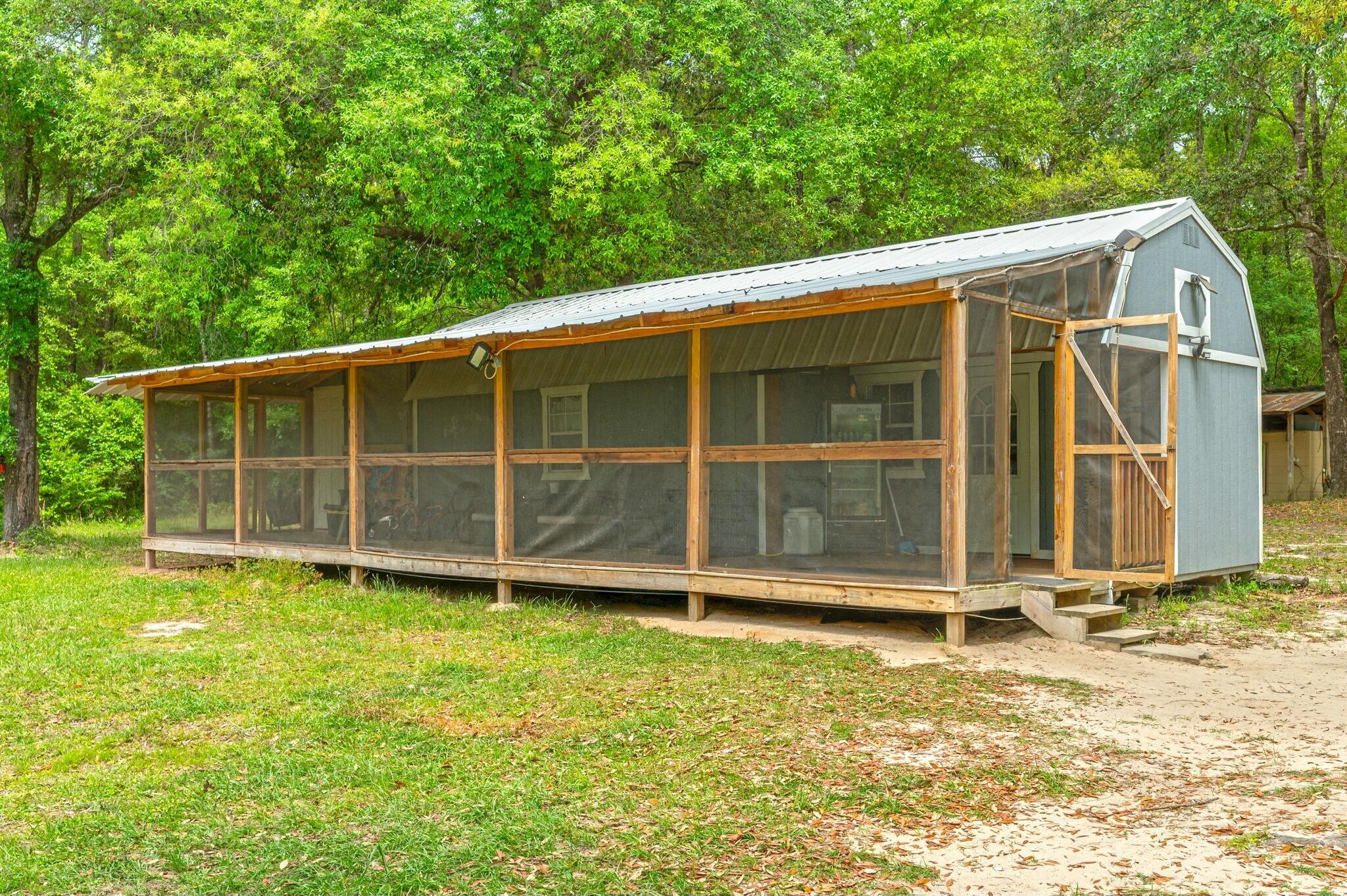 6188 Old River Road Baker, FL 32531 - Photo 4 of 34 a view of a backyard with a large tree