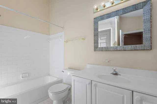 a bathroom with a sink a toilet and a bathtub