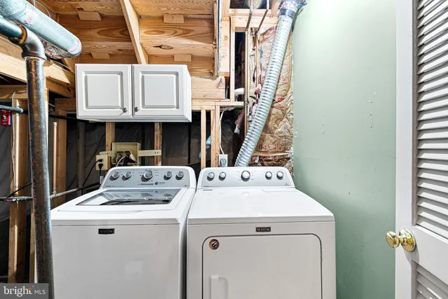 a utility room with dryer and washer