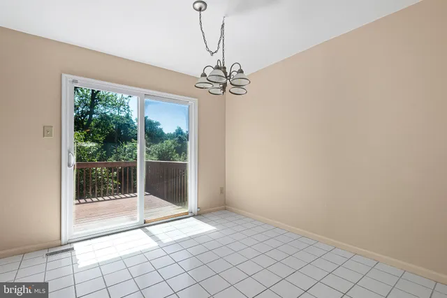 a view of an empty room with windows