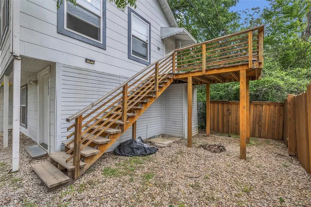 a backyard of a house with wooden floor