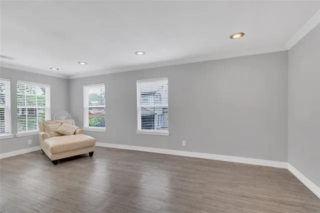 a living room with furniture and windows