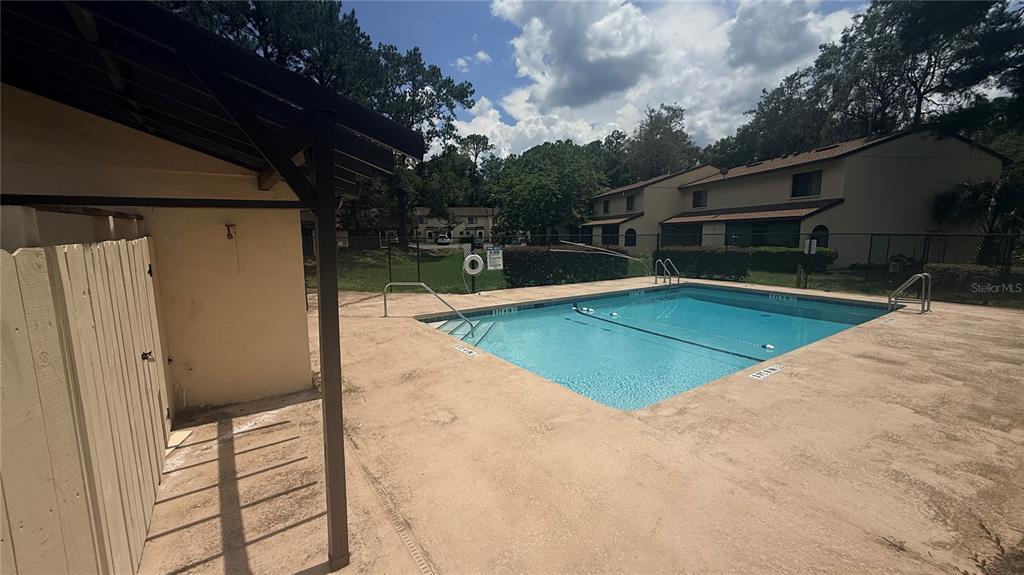 2735 Southwest 35th Place, Unit 1801 Gainesville, FL 32608 - Photo 5 of 7 a view of a backyard