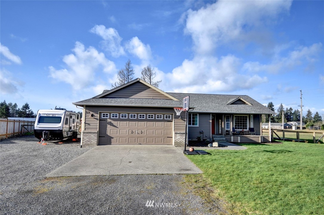 5124 183rd Lane Southwest Rochester, WA 98579 - Photo 1 of 31 a car parked in front of house