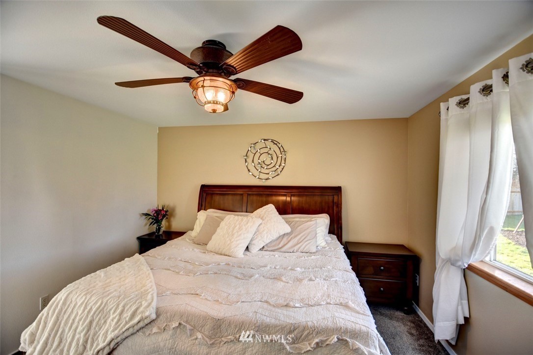 5124 183rd Lane Southwest Rochester, WA 98579 - Photo 11 of 31 a bedroom with a bed and a large mirror