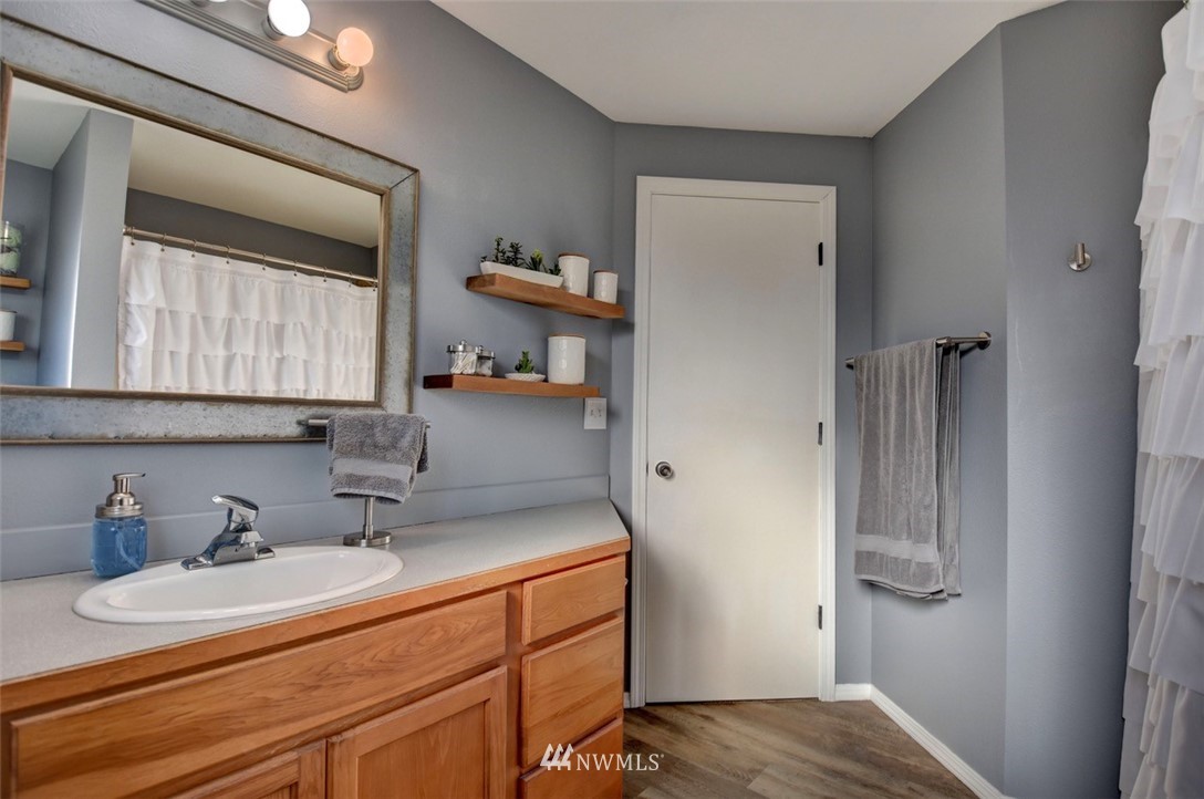 5124 183rd Lane Southwest Rochester, WA 98579 - Photo 14 of 31 a bathroom with a sink and a mirror