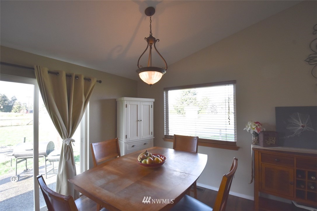 5124 183rd Lane Southwest Rochester, WA 98579 - Photo 19 of 31 a view of a dining room with furniture window and wooden floor