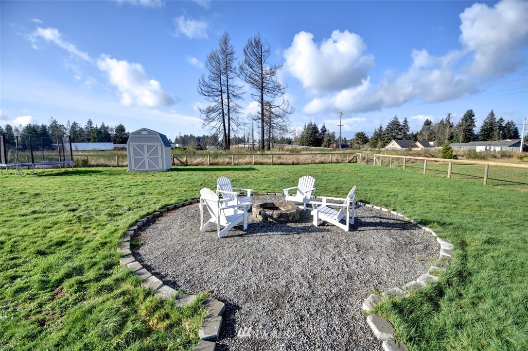 5124 183rd Lane Southwest Rochester, WA 98579 - Photo 24 of 31 a view of a garden and swimming pool in the garden