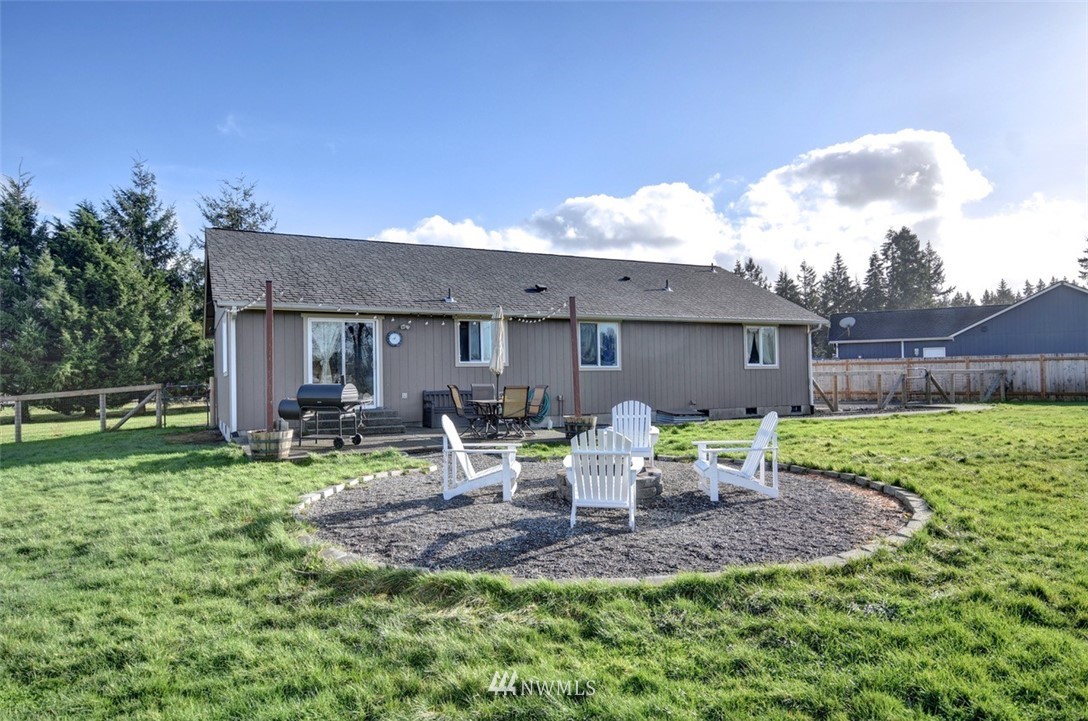 5124 183rd Lane Southwest Rochester, WA 98579 - Photo 25 of 31 a view of backyard of house with seating space