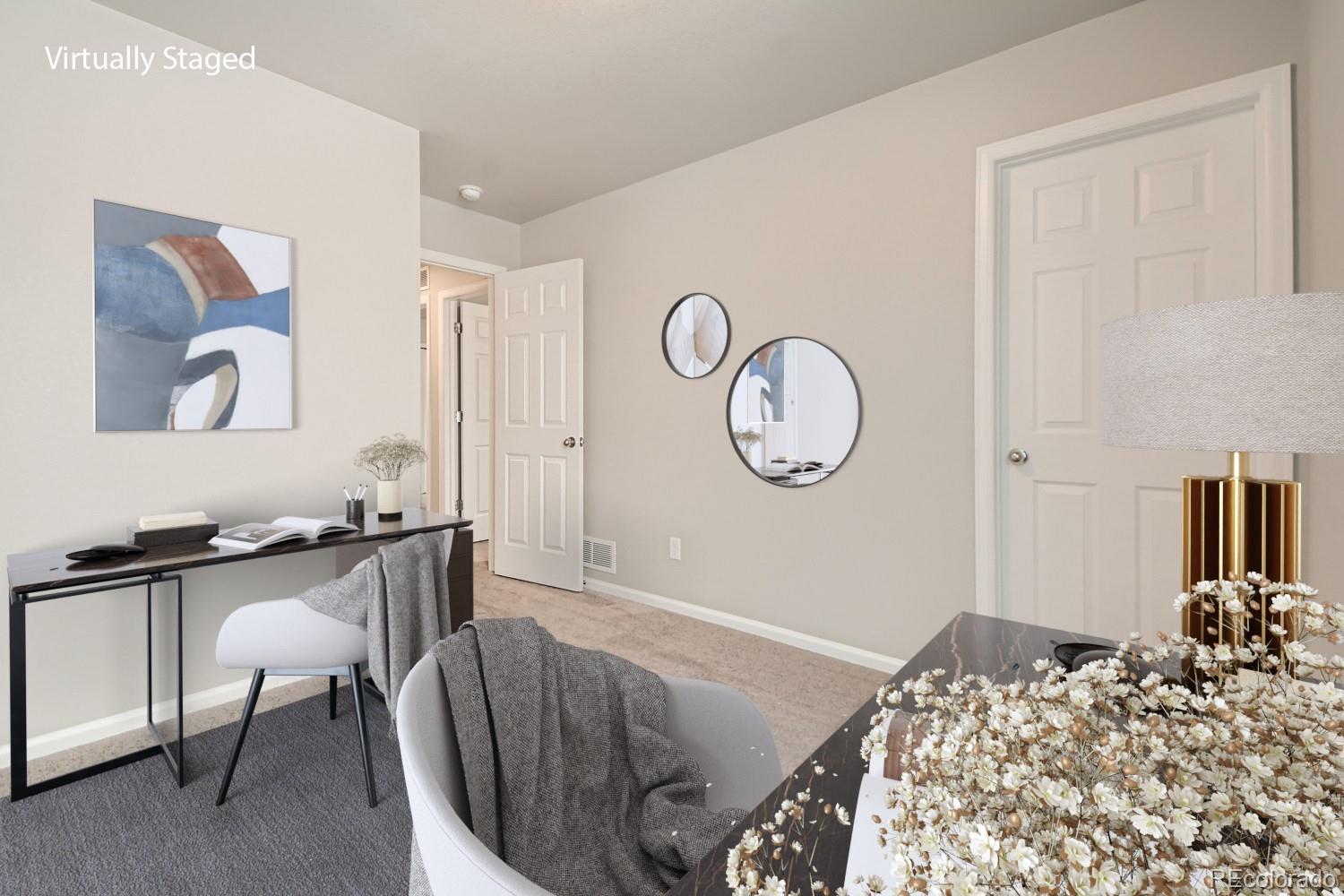 19032 High Point Boulevard Denver, CO 80249 - Photo 13 of 17 a bed room with a bed and a chair