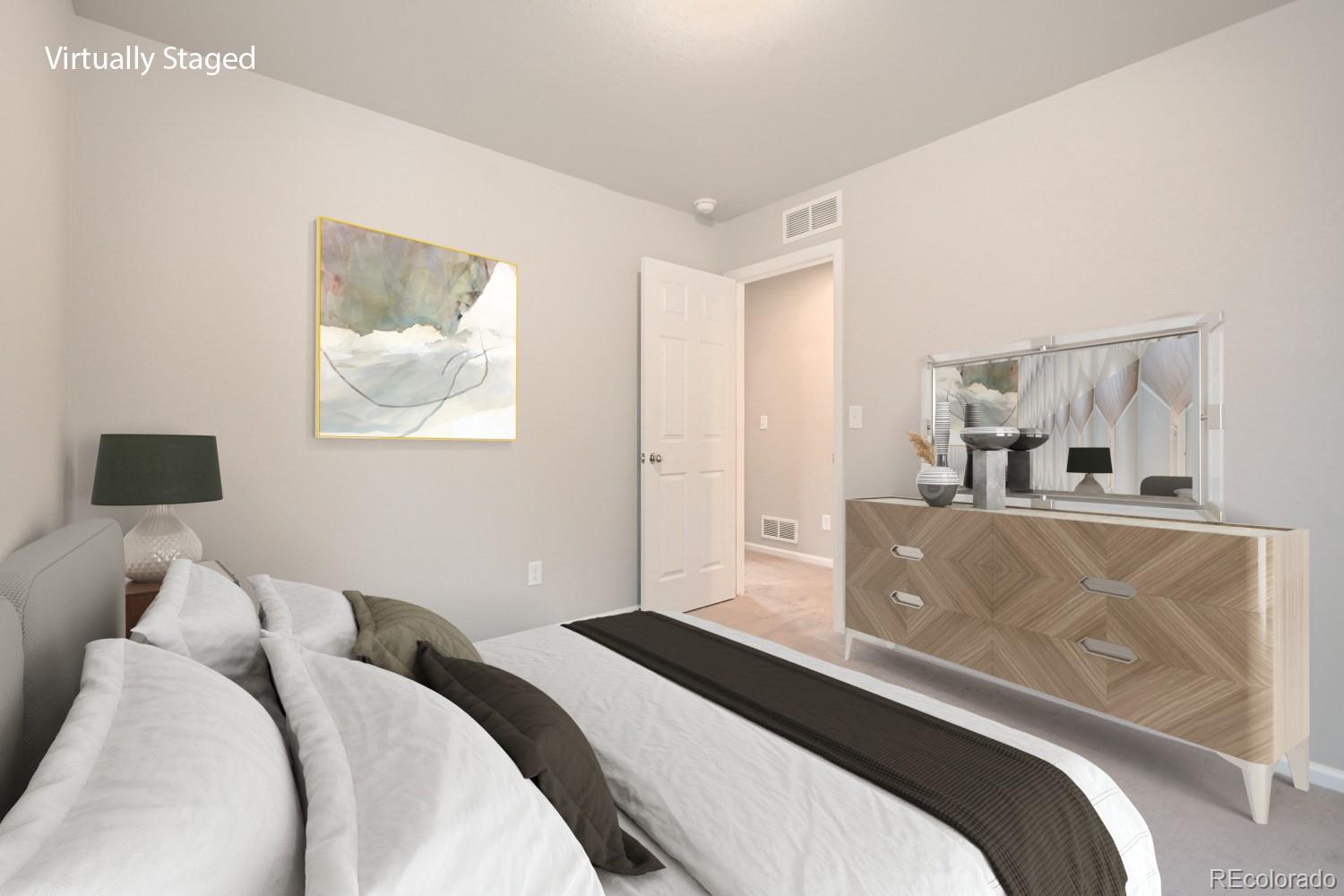 19032 High Point Boulevard Denver, CO 80249 - Photo 17 of 17 a bedroom with a bed and a painting on the wall