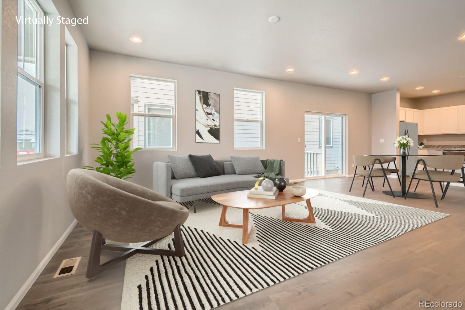 19032 High Point Boulevard Denver, CO 80249 - Photo 8 of 17 a living room with furniture and wooden floor