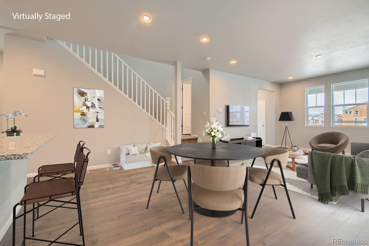 19032 High Point Boulevard Denver, CO 80249 - Photo 10 of 17 a view of a dining room with furniture