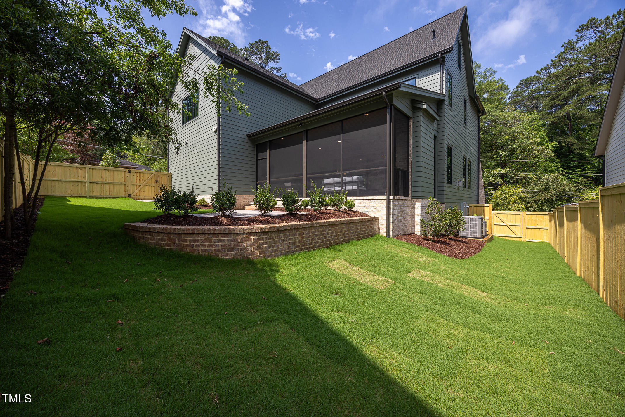 1000 Marilyn Drive Raleigh, NC 27607 - Photo 54 of 59 a front view of a house with a yard table and chairs
